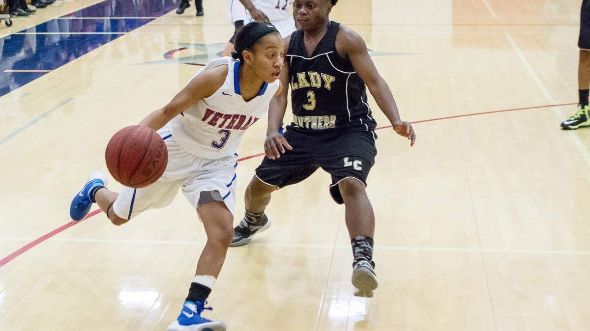 Veterans Kya Cochran (3) drives the lane against Liberty County on Tuesday in the GHSA Class AAAA Tournament