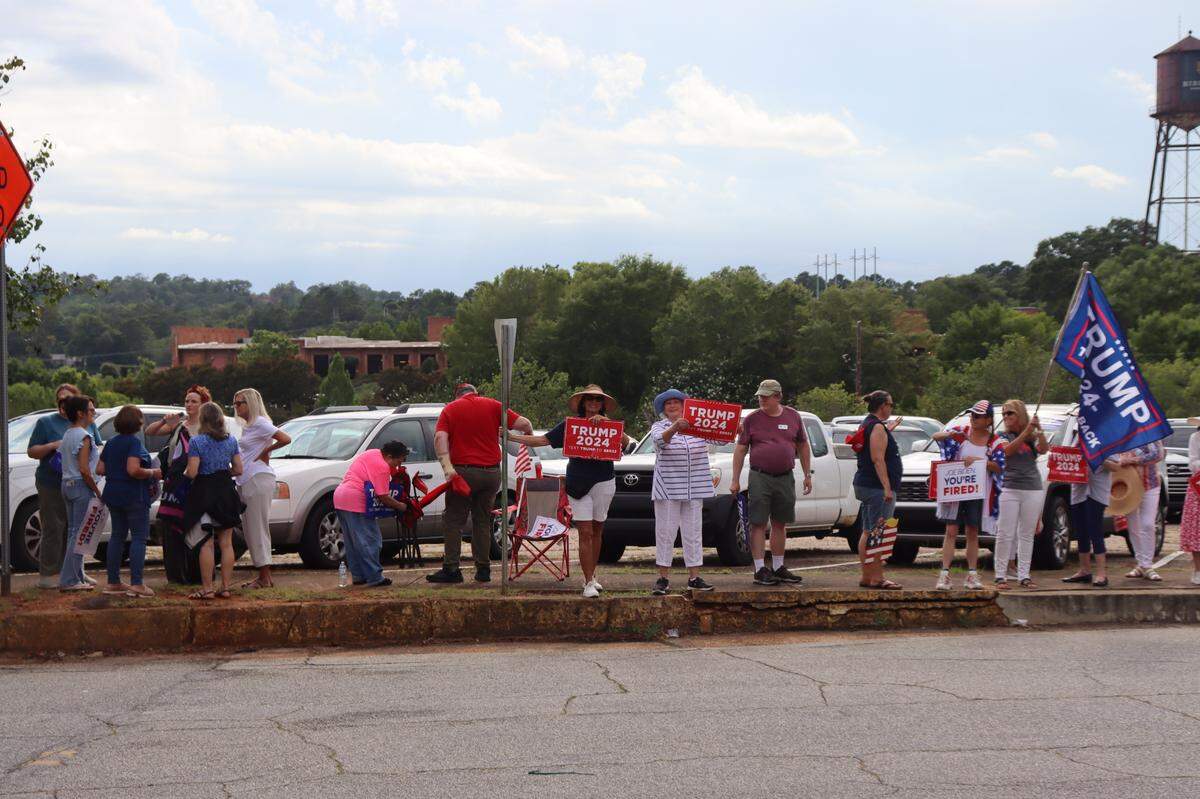 Supporters of Former President Donald Trump stood outside a speaking event featuring First Lady Jill Biden in Columbus, Ga., on Monday, July 8.
