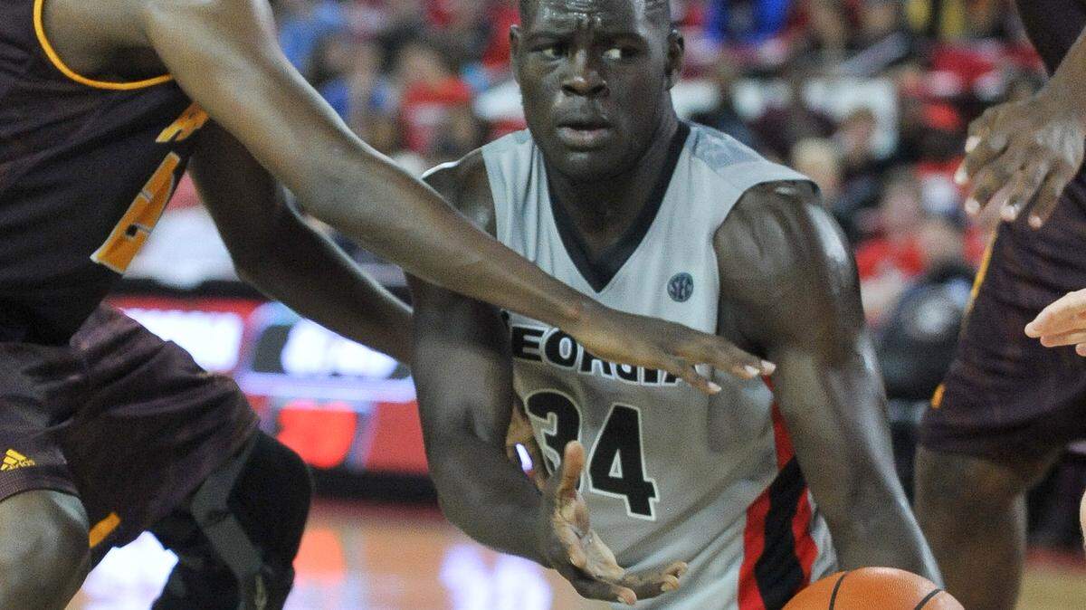 Georgia's Derek Ogbeide (34) passes the ball during an exhibition basketball game between the Georgia Bulldogs and the Armstrong State Pirates on Friday, November 6, 2015 at the Stegeman Coliseum in Athens, Ga. (Photo by Sean Taylor)