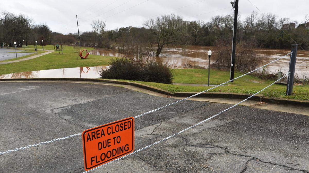 Recent rains have pushed the Ocmulgee River beyond its banks and forced the closing of walking trails and park areas from the levee to the junction of Interstates 16 and 75 on Tuesday.