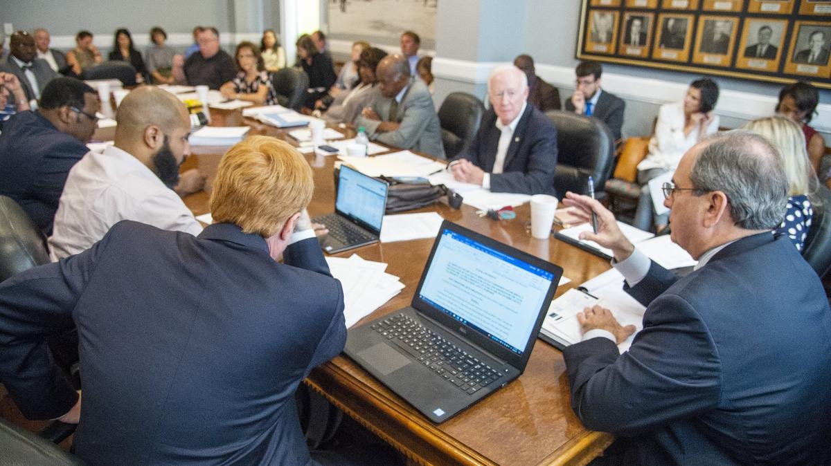Mayor Robert Reichert, right, speaks during a committee meeting to discuss a property tax increase Aug. 9  at the Macon-Bibb County Government Center.