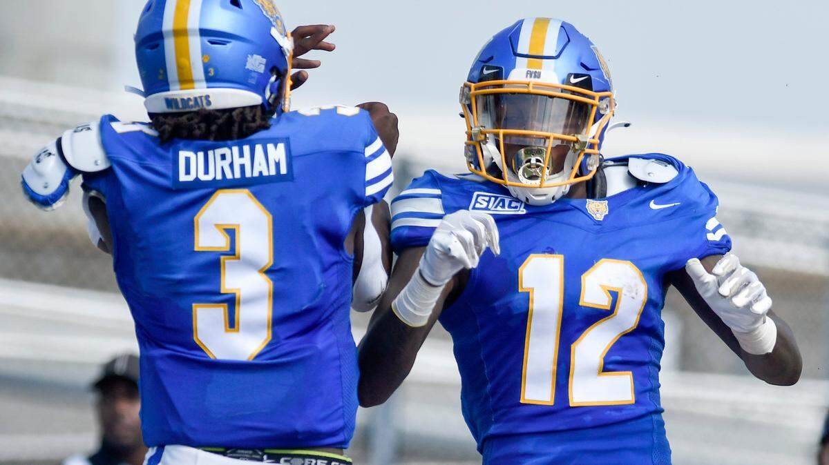 Fort Valley State receiver Corintheus Edmonds (12) celebrates a touchdown reception with quarterback Kelvin Durham in this Telegraph file photo. The Wildcats dropped to 7-2 on the season after their loss Saturday.