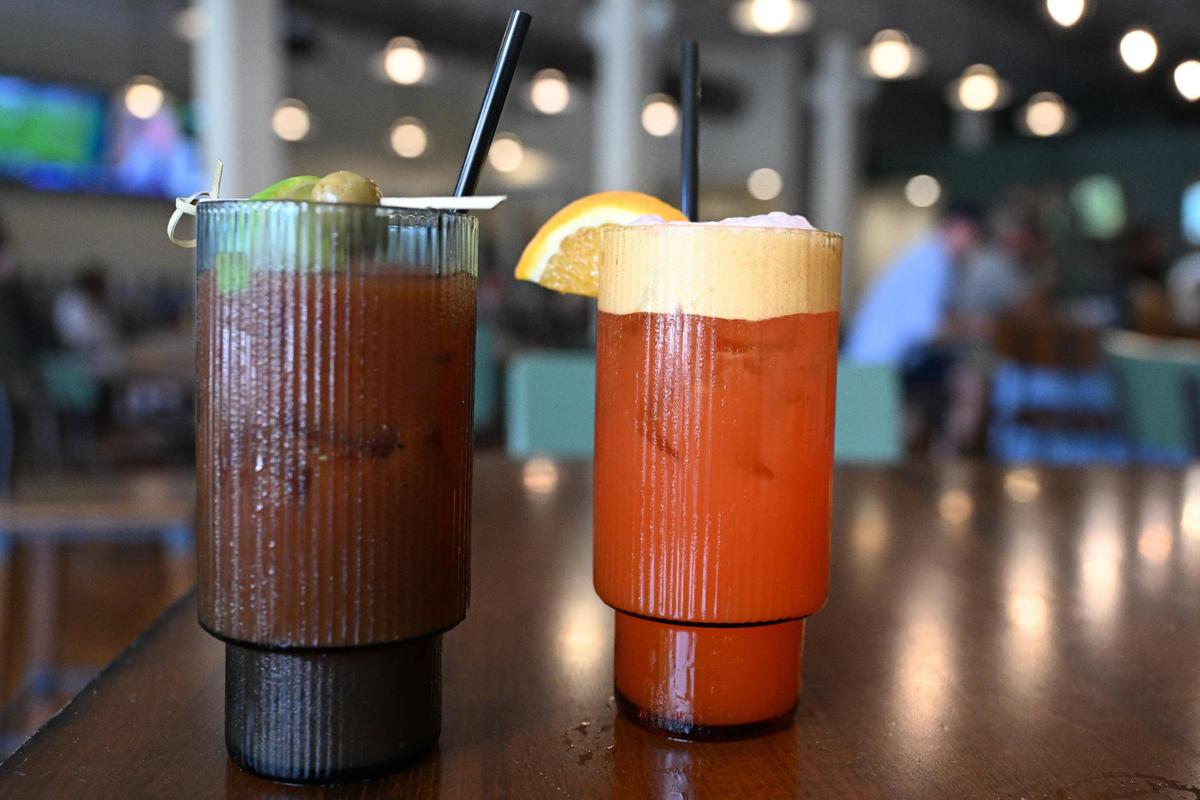 The Fresh Veggie Bloody Mary (left) and the Second Street Punch (right) sit inside of Ocmulgee Brewpub on Wednesday, July 9, 2025, in downtown Macon, Georgia. Ocmulgee Brewpub introduced a new cocktail menu as a part of their renovations.