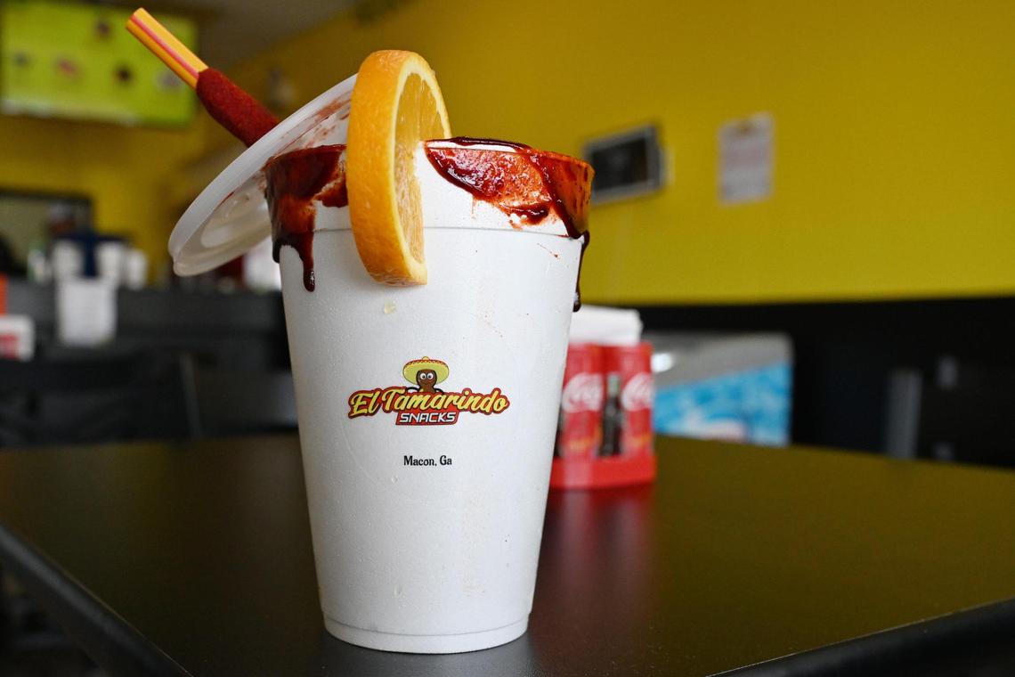 La Rusa sits on a table inside of El Tamarindo snacks on Friday, May 16, 2025, in Macon, Georgia. La Rusa is an iced beverage that includes lime juice, orange juice, Squirt soda, chamoy, Tajin and salt.