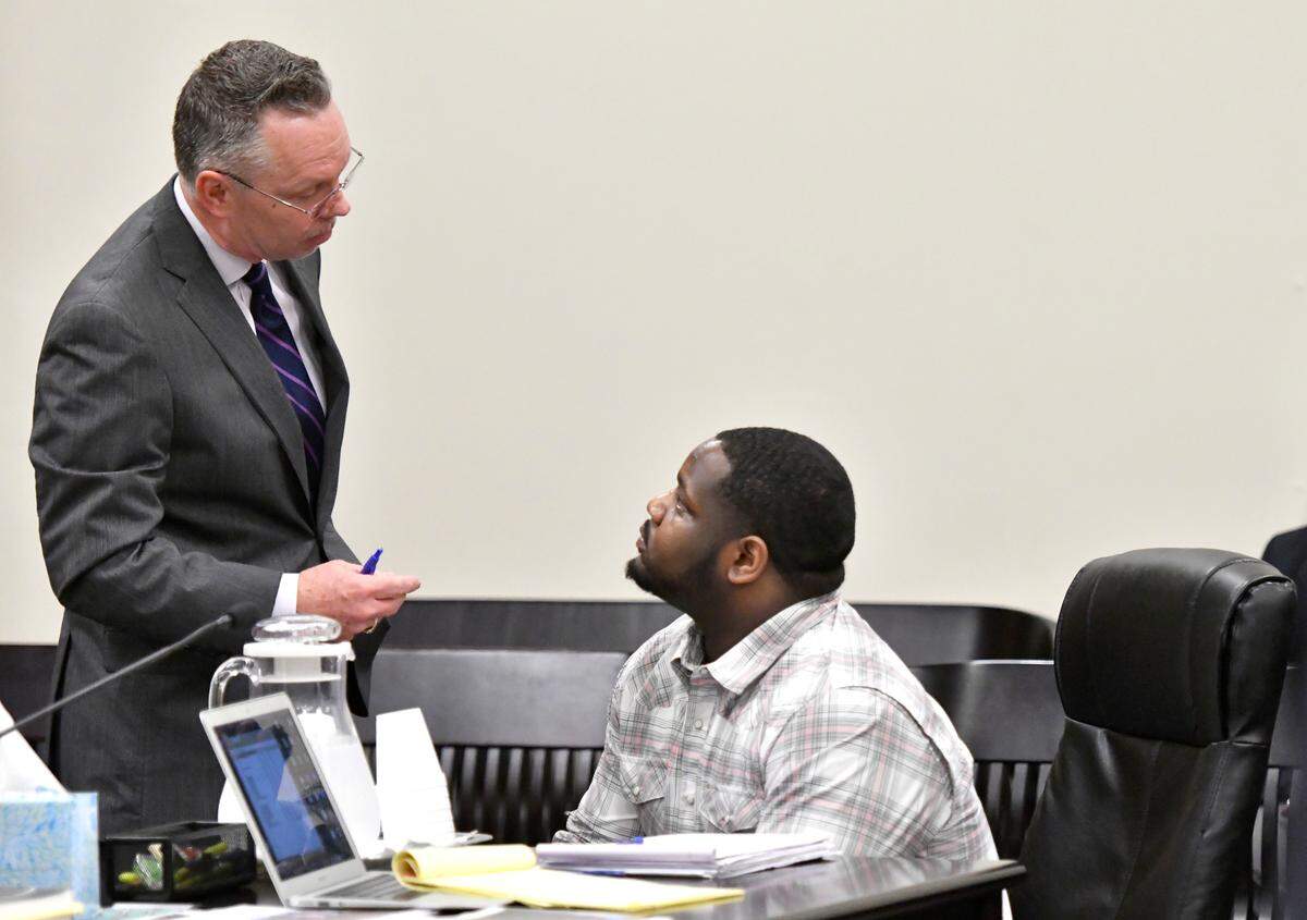 Attorney Gregory L. Bushway confers with his client, Keith Beddingfield Jr., who is on trial this week in the Feb. 4, 2018, shooting death of Javaris Antoine Brown.