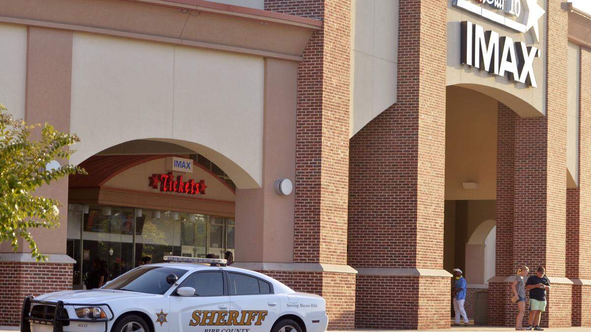 A Bibb County sheriff's car is parked out from of the AmStar 16 movie theater on Zebulon Road in 2015.