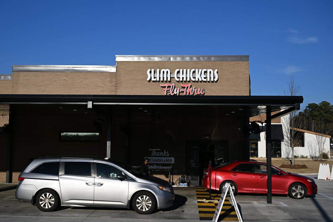 Vehicles line up outside the new Slim Chickens “fly-thru” location in Gray. This is the second drive-thru-only Slim Chickens to open in the nation.