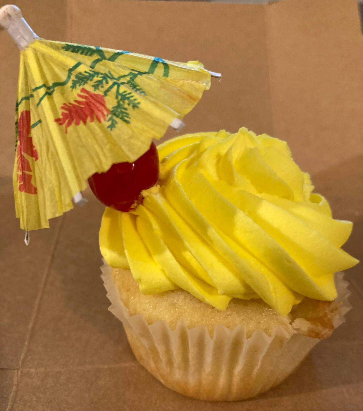 A Some Beach cupcake from Sweet Evelyn’s in downtown Perry. The cupcake is described as vanilla cake, coconut pineapple filling, vanilla buttercream and a Pina Colada mixer. The mixer is in a cupcake pipette, a slender tube that’s best squeezed right before eating the cupcake and not shown in above photo.