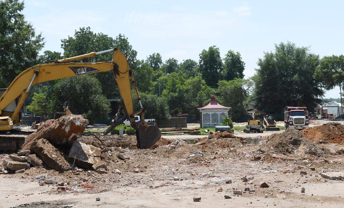 A bulldozer moves rubble on the property of the old New Perry Hotel on Friday, Aug. 9, 2024, in Perry, Georgia. Despite public outcry, the nearly 100 year old hotel was demolishedin order to build a new commercial space near downtown Perry.
