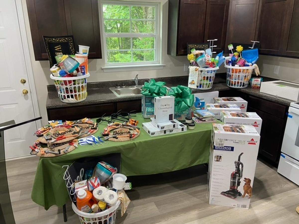 Housewarming gifts were part of a Macon Area Habitat for Humanity home dedication on Thursday. Two of the four homes dedicated were built on blight property.