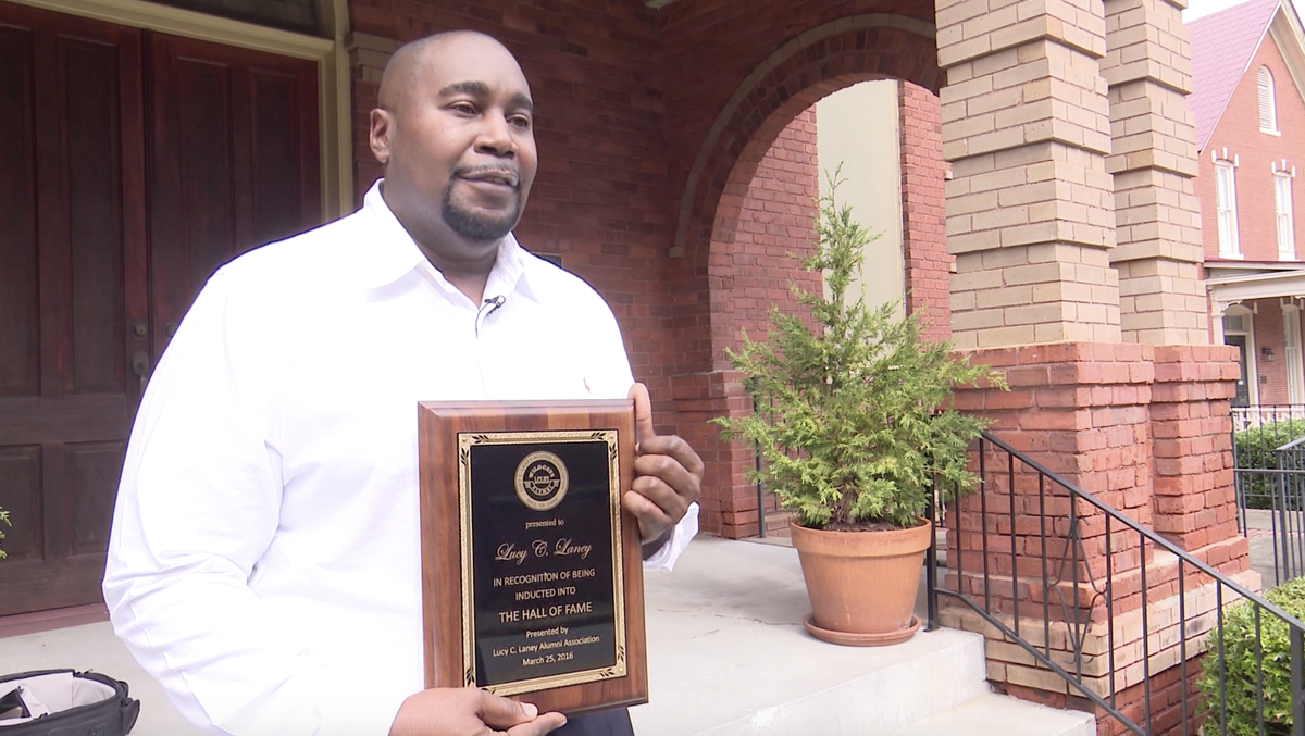 Michael Gray, the great, great, great nephew of Lucy Craft Laney, at Washington Avenue Presbyterian Church on Tuesday with a Hall of Fame plaque from Lucy Craft Laney High School in Augusta, Georgia, that was presented to the family in 2016.