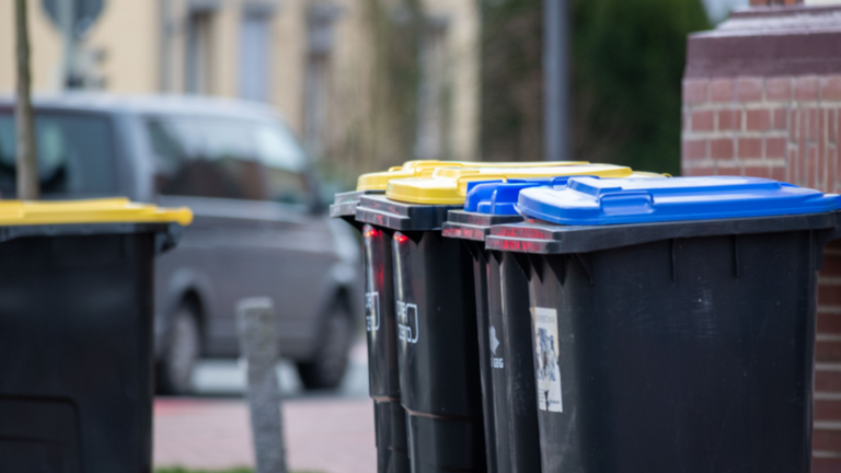 Is it illegal for my GA neighbors to put their trash in my garbage can? What state law says