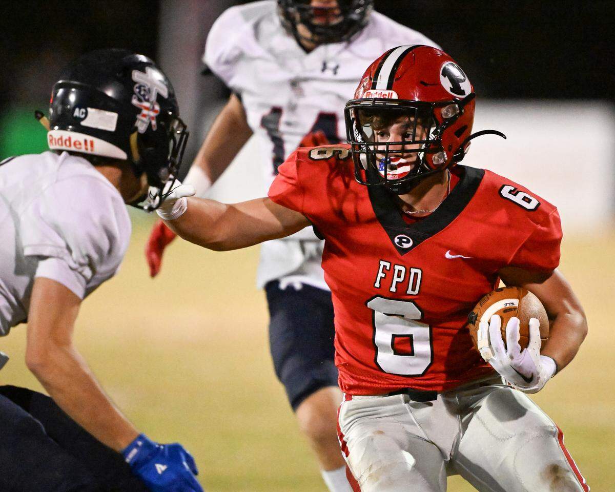 FPD running back Hayden Aulds (6) attempts to avoid a tackle during the Vikings’ second round playoff game against Strong Rock Friday night.
