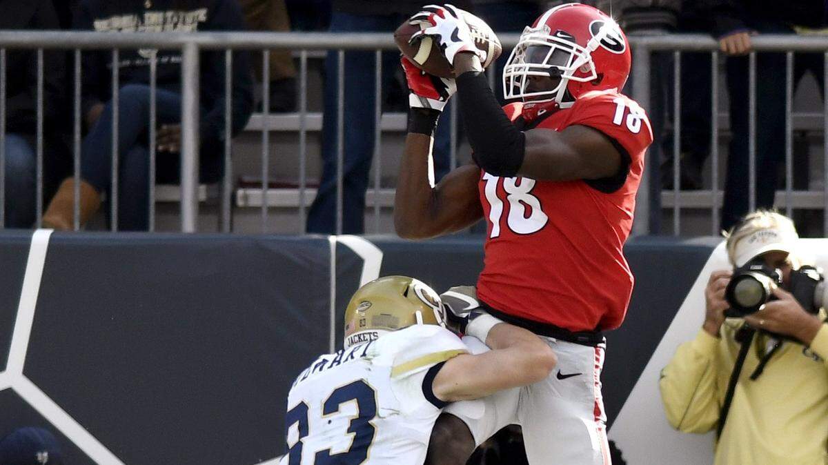 Georgia defensive back Deandre Baker intercepts a pass against Georgia Tech.