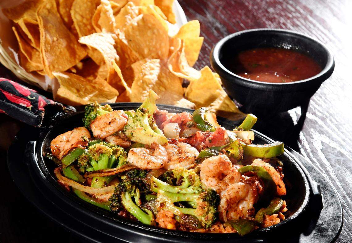 Woody Marshall/The Telegraph Macon, Georgia, 02/28/2017: The Border Skillet from Tango. Grilled shrimp, bell peppers, caramelized onions, grilled tomatoes, and broccoli over rice.