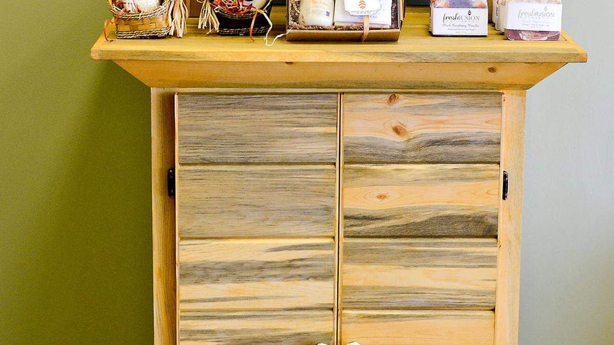 DARRELL SAPP/PITTSBURGH POST-GAZETTEThis cabinet was made with all recycled wood at Whistling Duck Furniture Co.