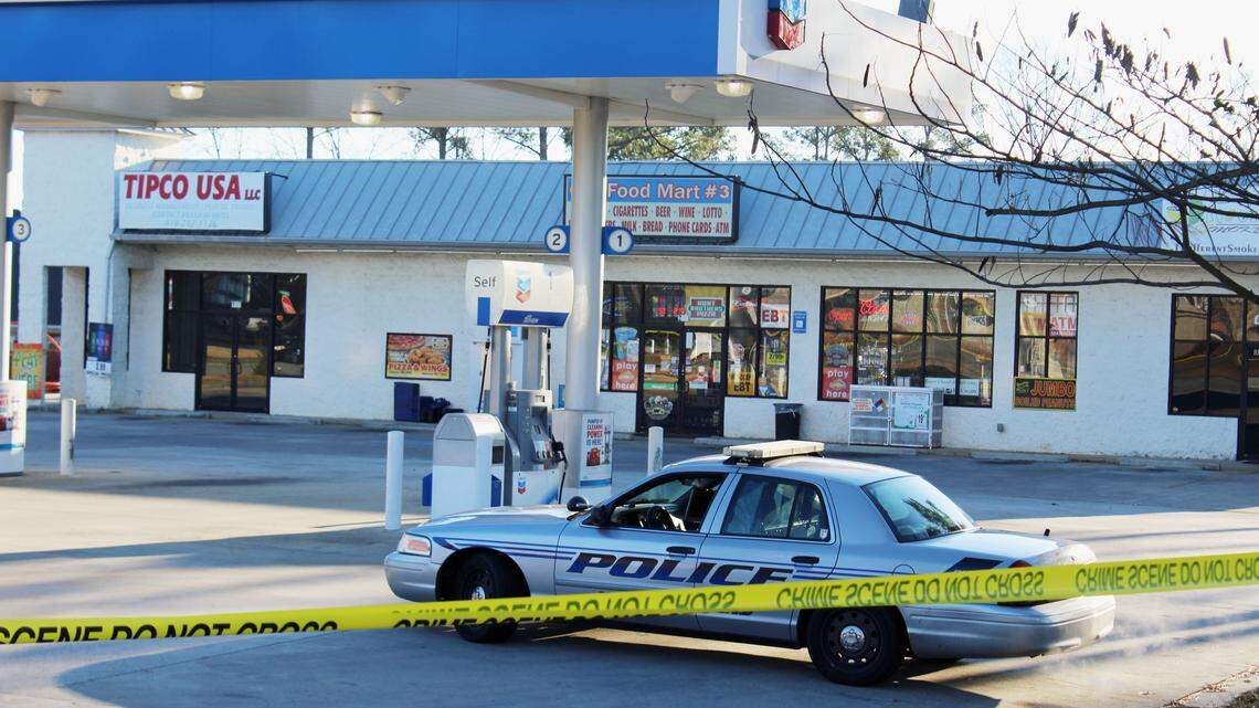 The Chevron station on Elberta Road in Warner Robins remained blocked off with crime scene tape Sunday morning after a clerk was shot dead Saturday night.