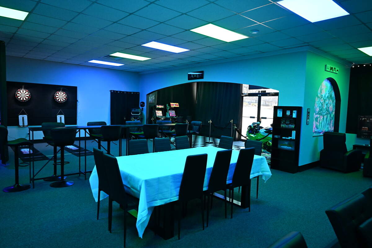 Various tables and seats are available around the televisions for video games, along with darts and arcade games at Disconnect Gaming Lounge gearing up to open in Warner Robins. Owners Jay Wilson and Adam Edwards plan to install two projectors above the table with the white tablecloth that will display game boards for tabletop gaming.