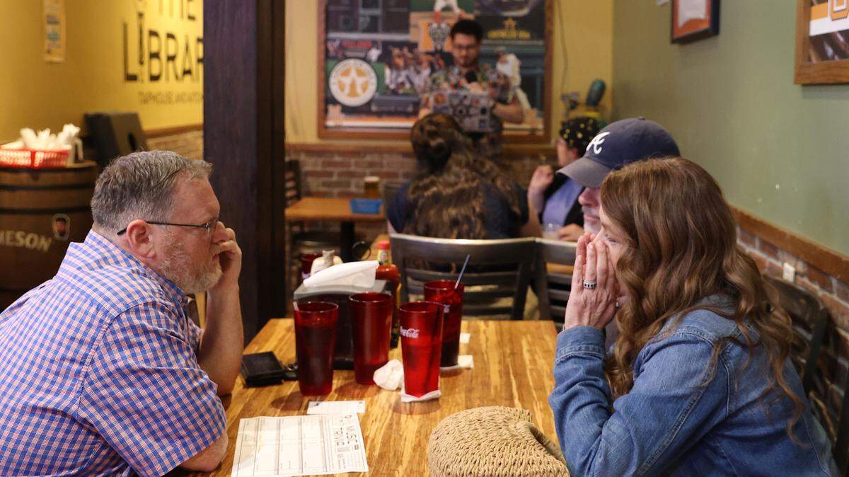 Chad Walton, from Byron, Georgia, (left) discusses an answer in Music Trivia with Donna Sellers, from Warner Robins, Georgia, on Wednesday, Feb. 5, 2025, at The Library Tap Room and Kitchen in Macon, Georgia. The Library hosts weekly Music Trivia hosted by Talk Nerdy to Me, a local business that hosts themed trivia throughout Middle Georgia. 