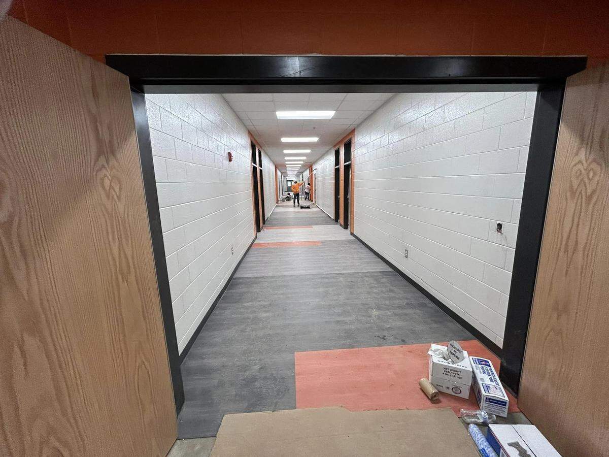 Workers from ICB Construction Group paint and renovate the Pre-K and 1st grade hall at the New Springdale Elementary School.