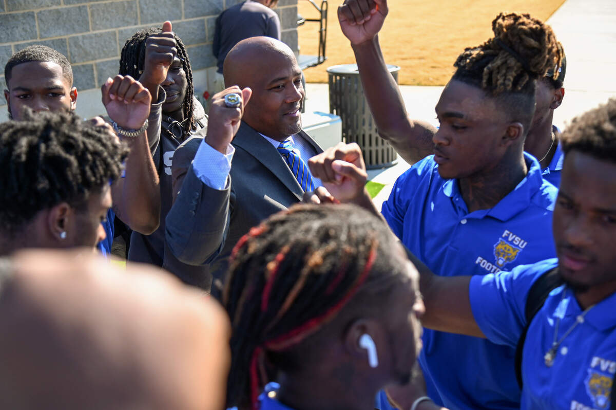 New Fort Valley State head football coach Shawn Gibbs speaks with members of the football team after being introduced Thursday afternoon.