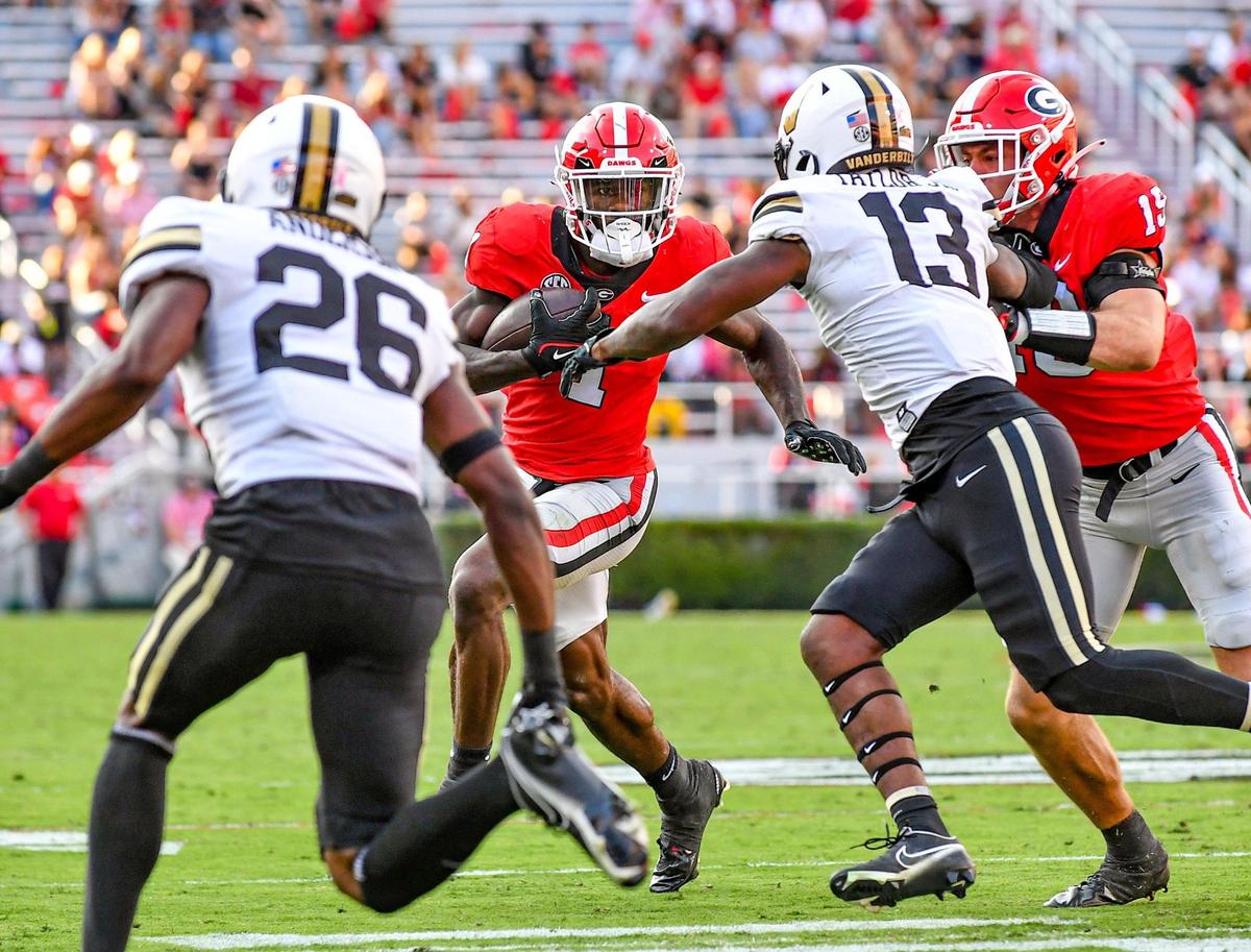 Georgia wide receiver Marcus Rosemy-Jacksaint sprints around the end for a gain against Vanderbilt. Georgia beat Vanderbilt 52-0.