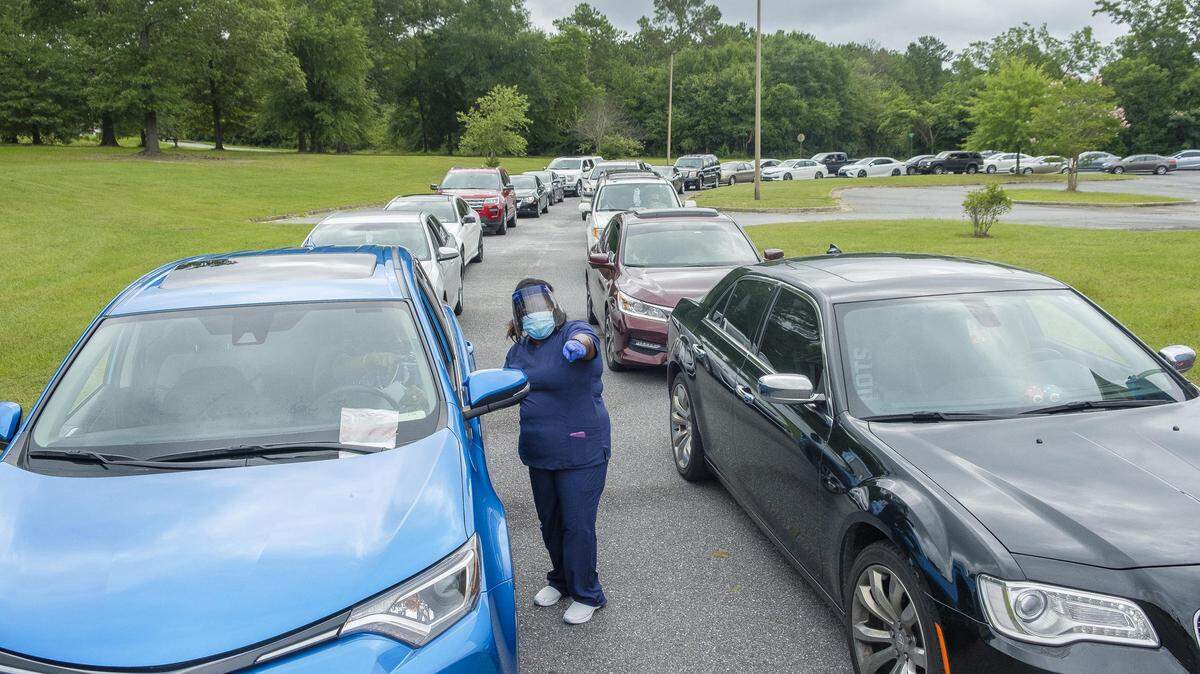 Coronavirus testing in the parking lot of St. Paul AME Church in Macon on July 8. Georgians are often forced to wait more than a week to get results back from state and private labs, leaving them without crucial information about their own health.