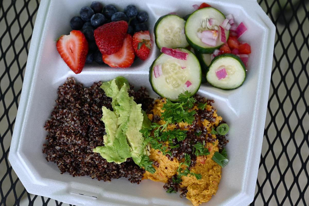 The Spring Vegan Bowl sits outside of Grow Fresh Local Food on Tuesday, June 3, 2025, in Macon, Georgia. The bowl features roasted carrot hummus, avocado, quinoa, cucumber salad, mixed berries.