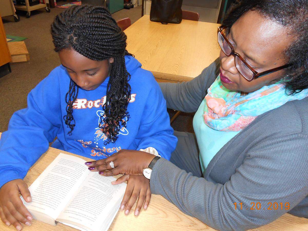 Warner Robins grandmother Gloria Snipes, right, is known as the “go-to” at Miller Elementary School where her 10-year-old granddaughter Amiyah Joiner, left, is in the fifth grade. Snipes knows that being engaged with her granddaughter at school helps her to succeed.