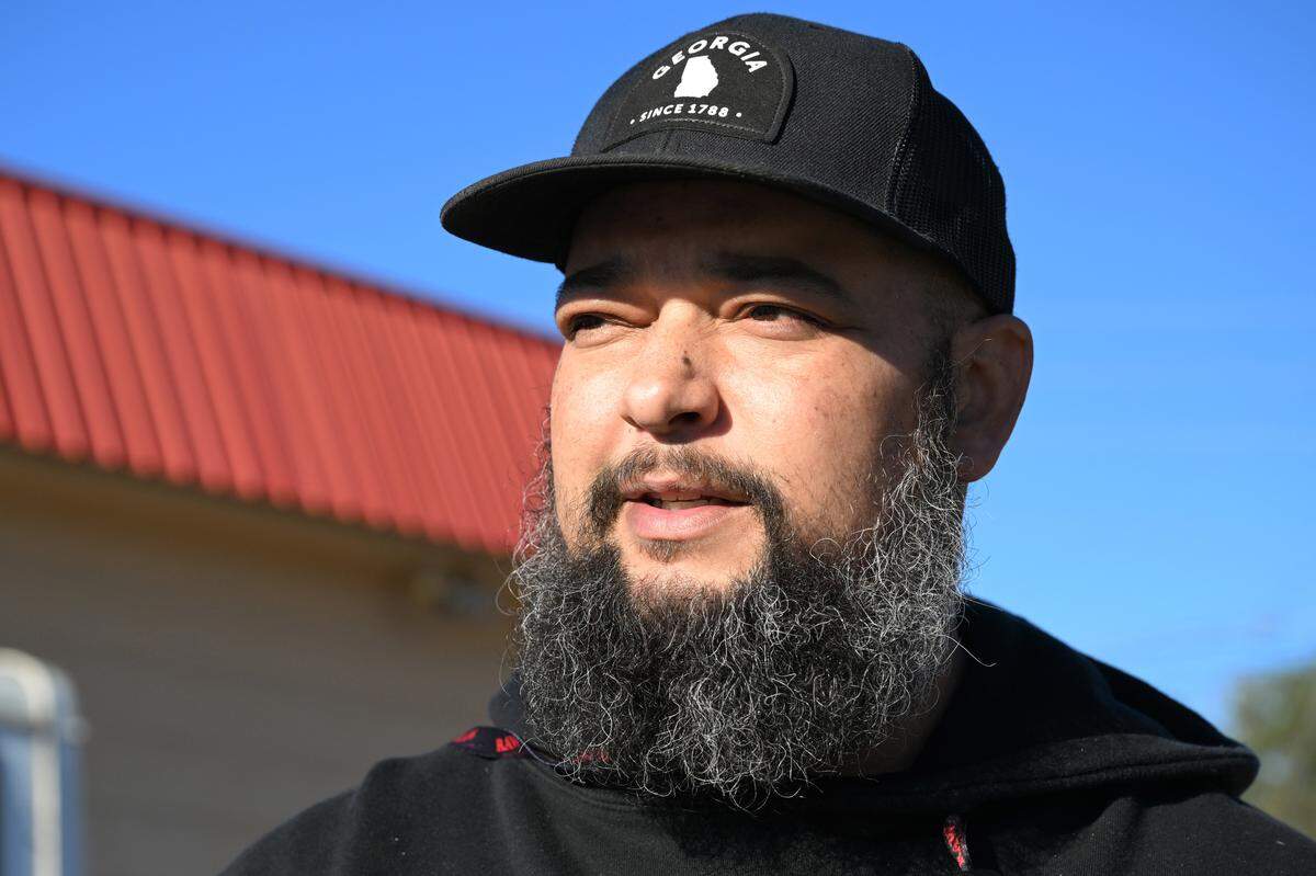 Phillip Hinson, 42, from Jones County, stands in front of his food truck on Friday, Feb. 6, 2026, in Shurlington Plaza in Macon, Georgia. Hinson sells loaded baked potatoes from a food truck in east Macon and is working to re-open a physical restaurant. 