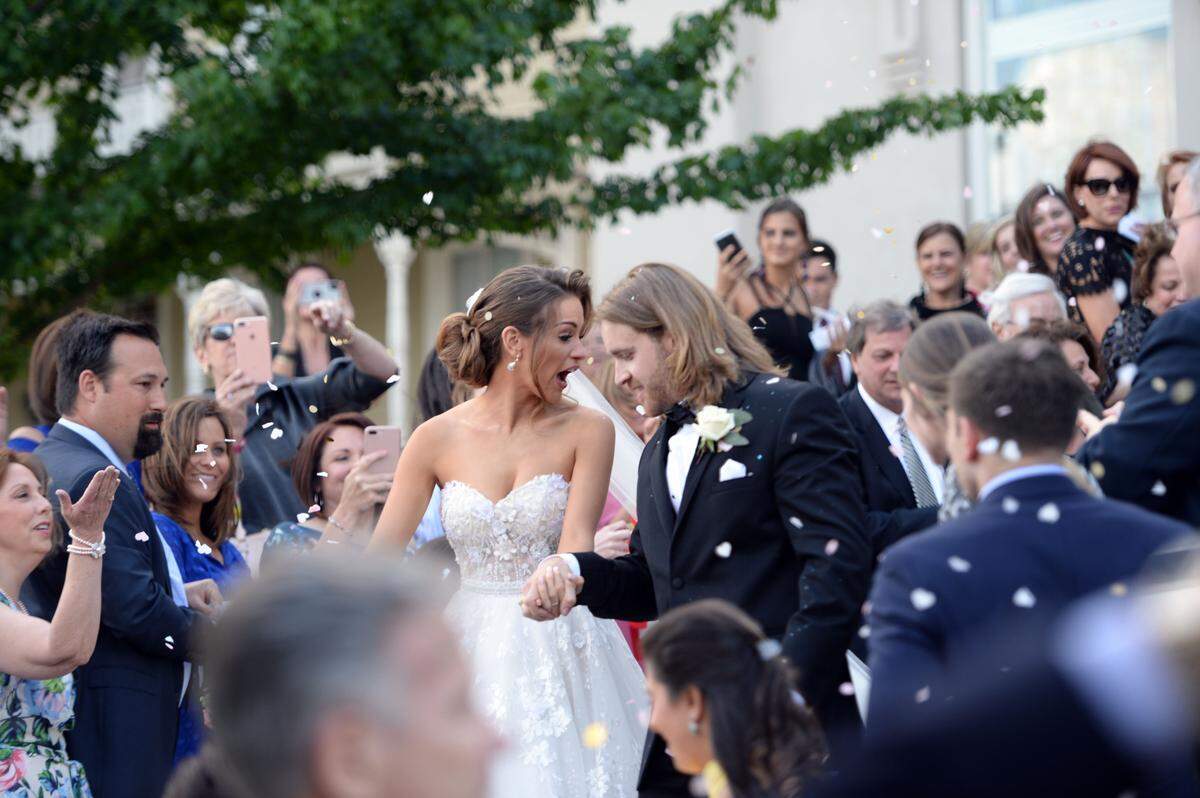 Miss America 2016 Betty Cantrell, at left, and Spencer Maxwell pass well wishers after exchanging vows Friday at Holy Cross Greek Orthodox Church Friday afternoon.