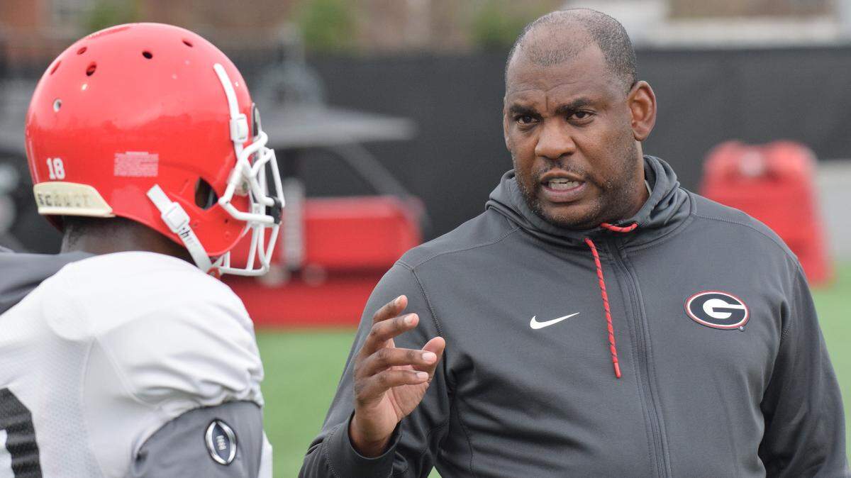 Georgia defensive coordinator Mel Tucker talks to Georgia defensive back Deandre Baker (18) during the Bulldogs’ practice on the Woodruff Practice Fields in Athens, Ga., on Tuesday, March 27, 2018. (Photo by Steven Colquitt)