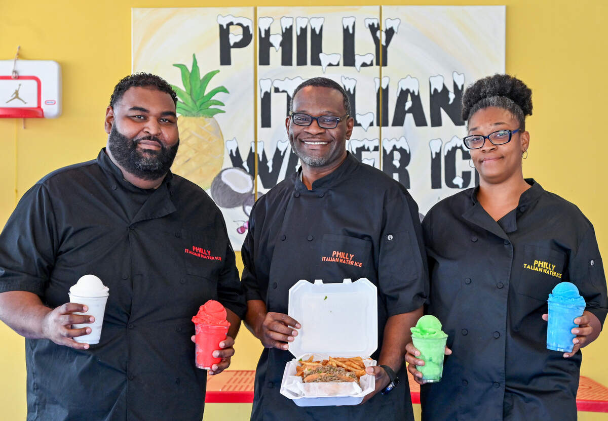 Sherrod Dillard, center, owner of Philly Italian Water Ice in Byron runs the restaurant with his wife Ngozi and cousin DuShaun Dillard.