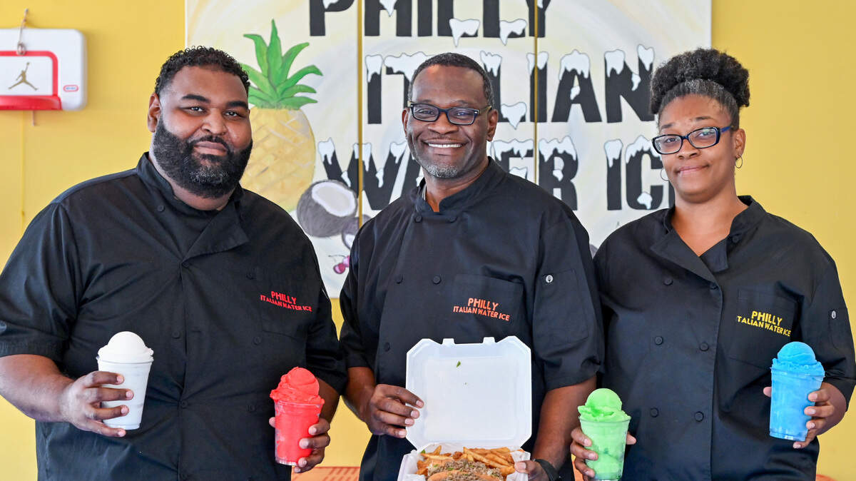 Sherrod Dillard, center, owner of Philly Italian Water Ice in Byron runs the restaurant with his wife Ngozi and cousin DuShaun Dillard.