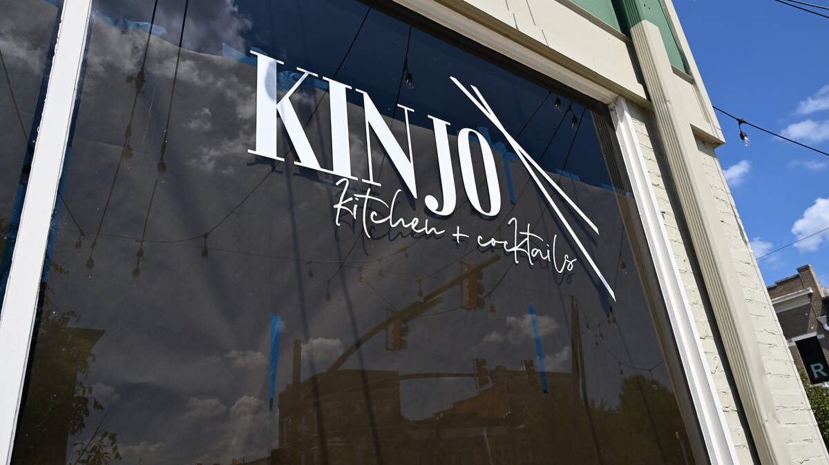 Brown paper lines the windows of Kinjo Kitchen + Cocktails on Monday, Aug. 18, 2025, in downtown Macon, Georgia. The restaurant announced on Monday that they were closed effective immediately. 