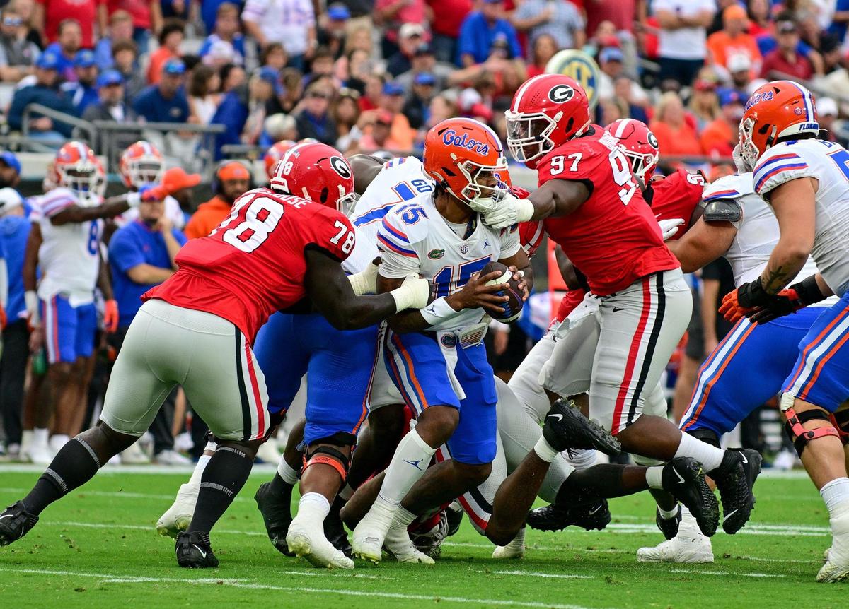 Georgia defenders Nazir Stackhouse (78) and Warren Brinson (97) pressure Florida quarterback Anthony Richardson Saturday in Jacksonville.