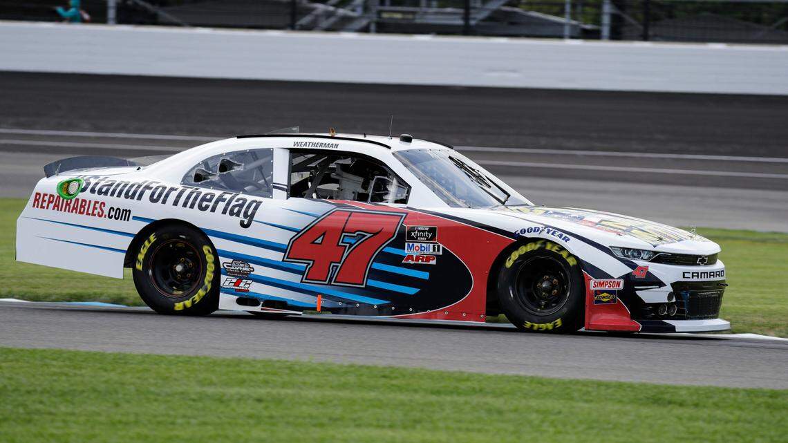 NASCAR Xfinity Series driver Kyle Weatherman drives through a turn during practice for the NASCAR Xfinity Series auto race at Indianapolis Motor Speedway in Indianapolis, Friday, July 3, 2020. The car carries the hashtag #standfortheFlag and features a We Stand for the National Anthem paint scheme.