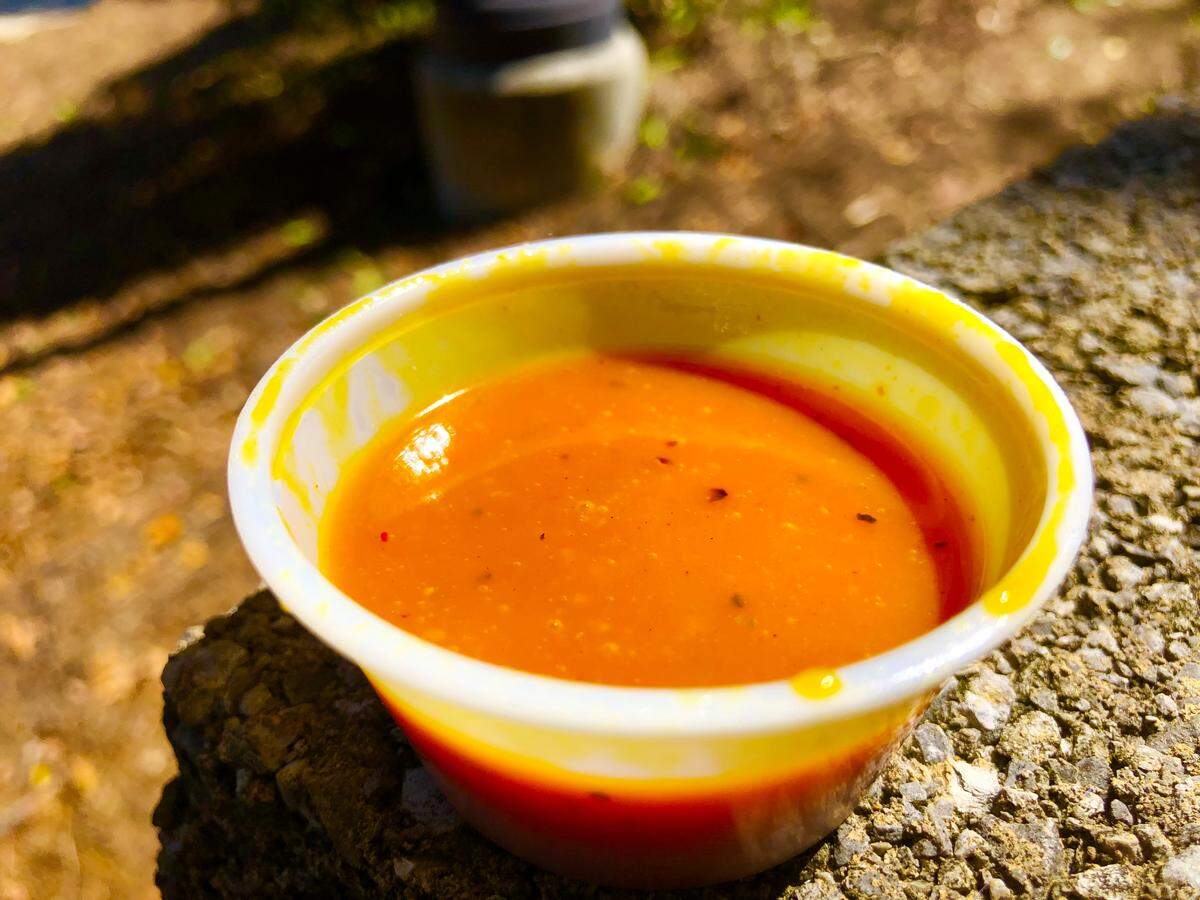 A cup of Mercer Gold wing sauce from Francar’s Buffalo Wings in Mercer Village on Linden Avenue in Macon, Georgia.