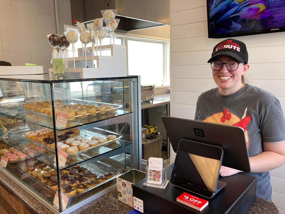 Heather Manning at the cash register at Mini Dixie Donuts in Warner Robins.