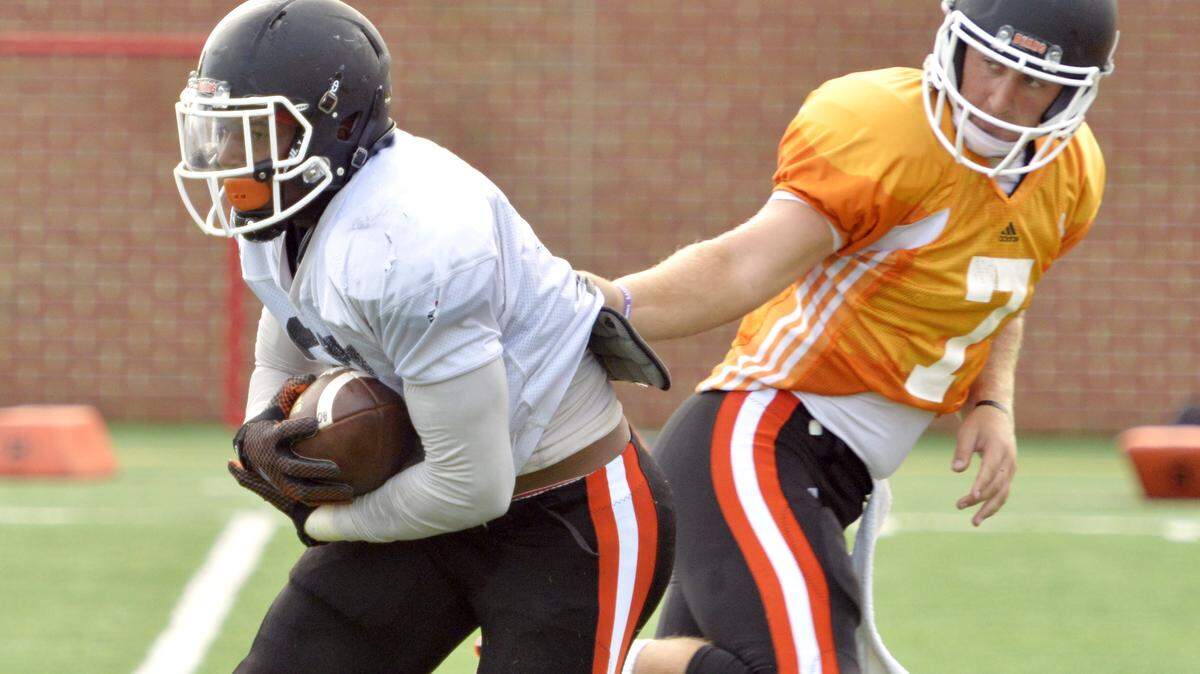 JASON VORHEES/THE TELEGRAPHMercer quarterback John Russ, right, and Alex Lakes were both key for an offense that averaged 32.5 points per game last season.