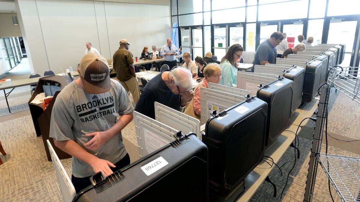 Voters cast electronic ballots at Northway Church in Macon on May 22.