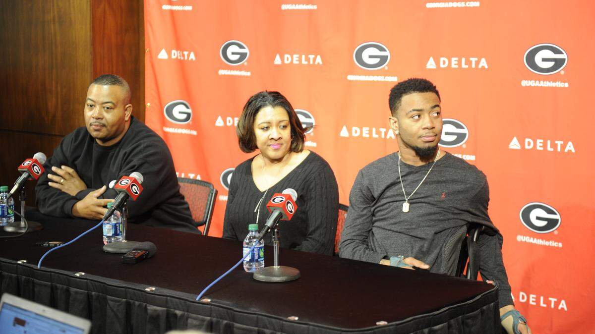 JOHN KELLEY/GEORGIADevon Gales, right, visited with Georgia with his parents, Donny and Tanisha, on Thursday.