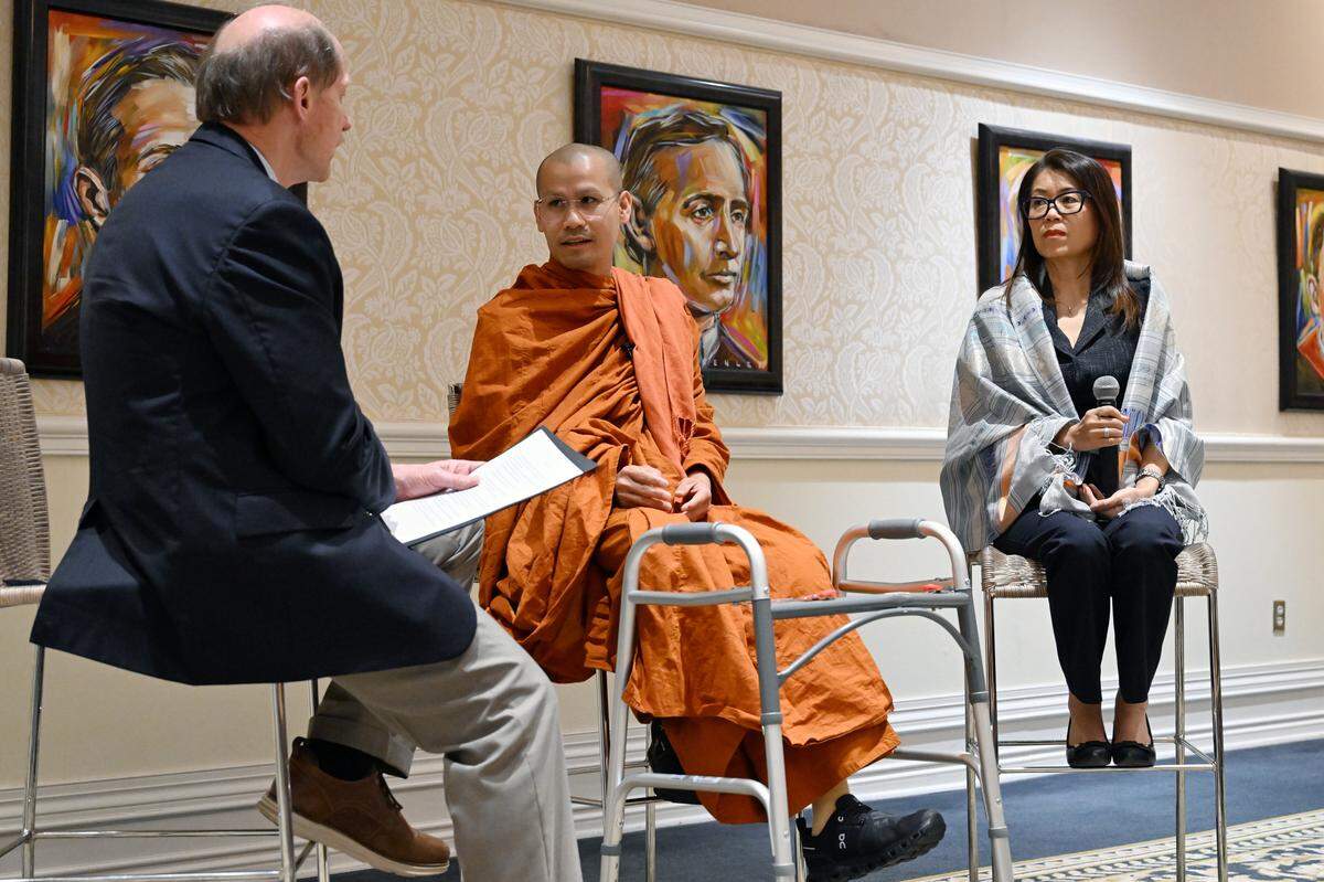 Bhante Dam Phommasan (middle) speaks with Mercer On Mission Director Craig McMahan (left) and translator Kim “Ting” Pathammavong during a Q&A at Mercer University on Wednesday, March 18, 2026, in Macon, Georgia. Doctors from the university’s Mercer On Mission team fitted Phommasan for a new prosthetic leg after he was injured in an accident during the national Walk for Peace.