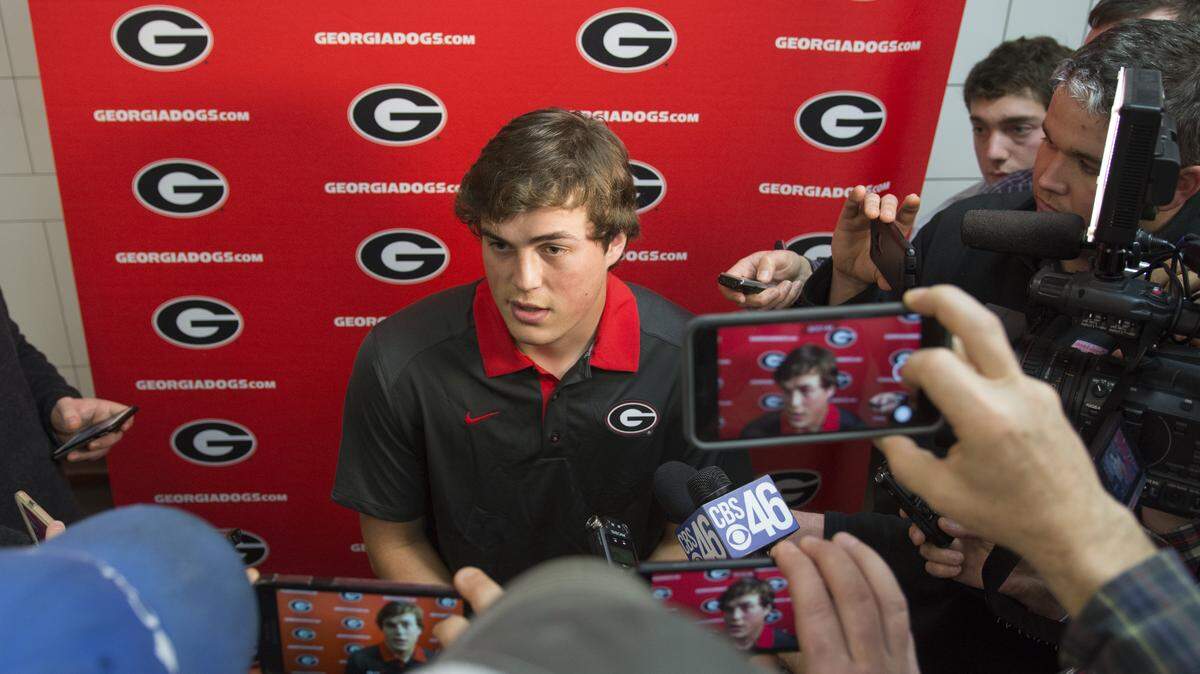 Georgia quarterback Jacob Eason conducts interviews during Signing Day at Butts-Mehre Heritage Hall on Wednesday, Feb. 3, 2016, in Athens, Ga. (Photo by David Barnes)