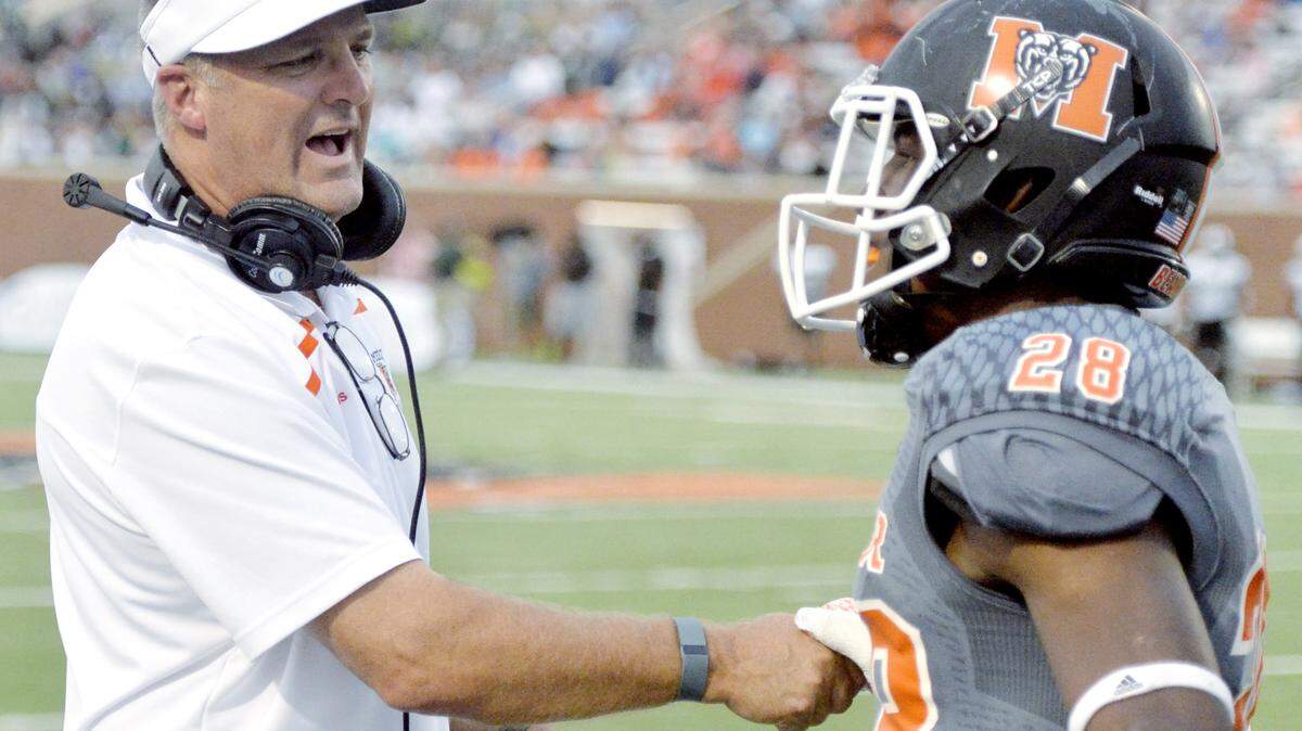 Mercer head coach Bobby Lamb congratulates running back Tee Mitchell (28) after a touchdown in the second quarter of the Bears’ Sept. 12 game against Stetson.