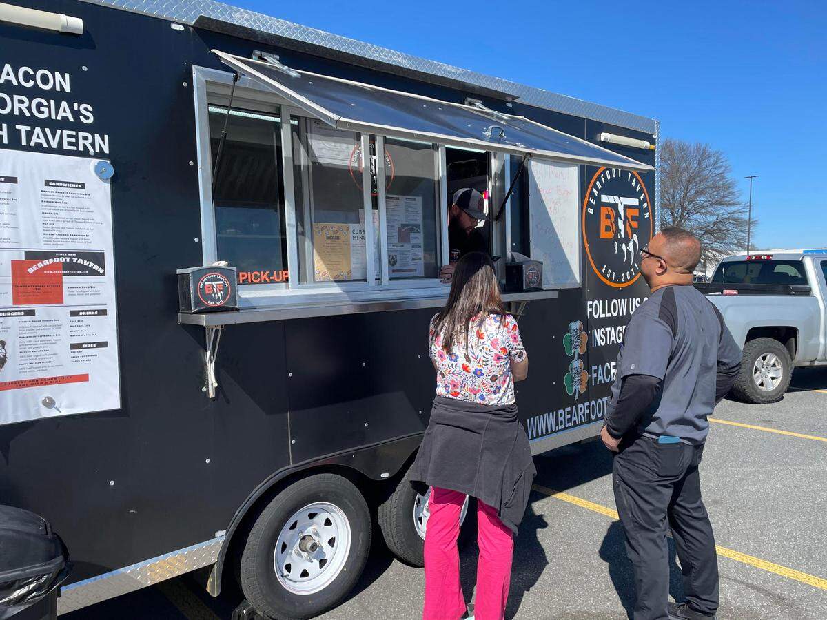 Melvin Edwards and Erika Watson walked over from The Imaging Center of Warner Robins to try downtown Macon’s Bearfoot Tavern for the first time when its food truck was parked recently outside Lowe’s Home Improvement on Watson Boulevard.