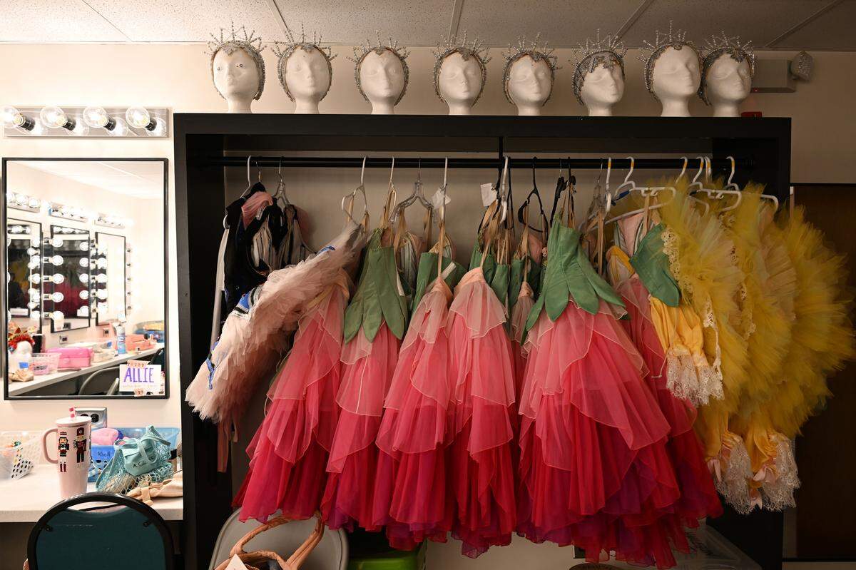 Headpieces for the snow scene, as well as costumes for Flowers and Marzipan dancers, sit hung up inside a dressing room inside the Grand Opera House on Tuesday, Dec. 9, 2025, in Macon, Georgia. 