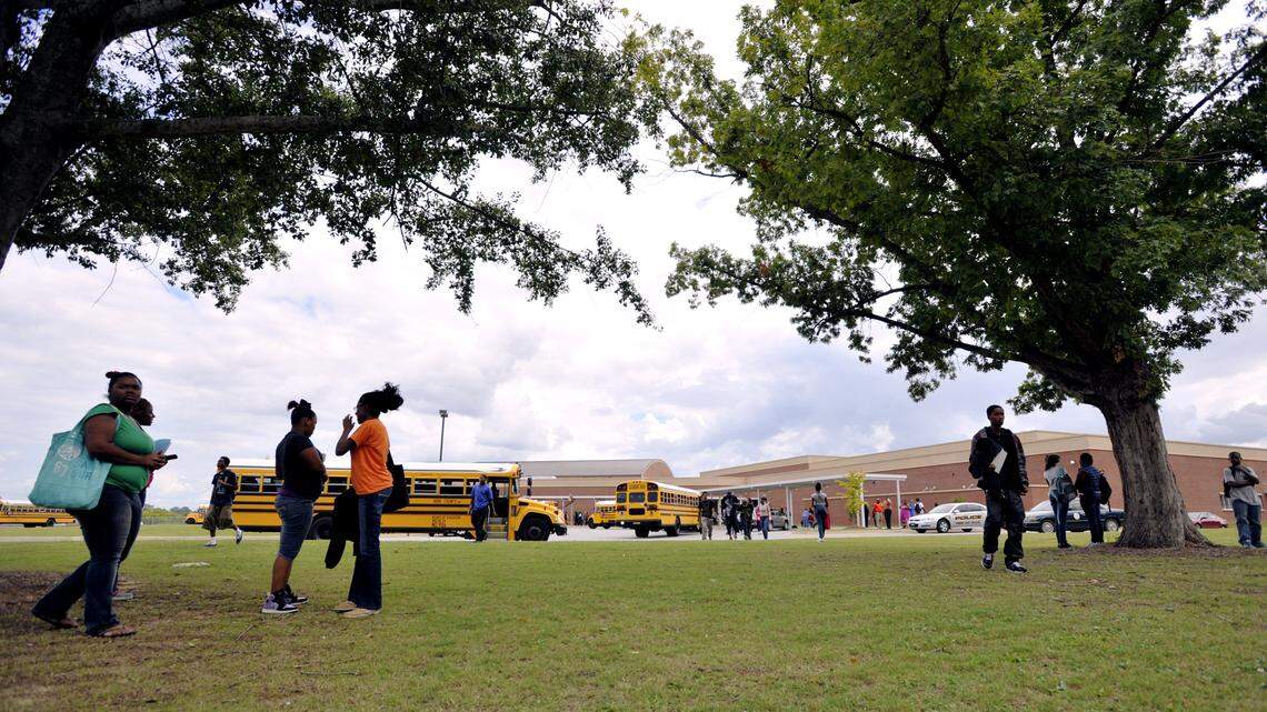 Central High School students gather under the oaks on campus as others board buses after school in 2012. The school is one of 18 in Bibb County that made the 2017 "Beating the Odds" list from the Governor's Office of Student Achievement.