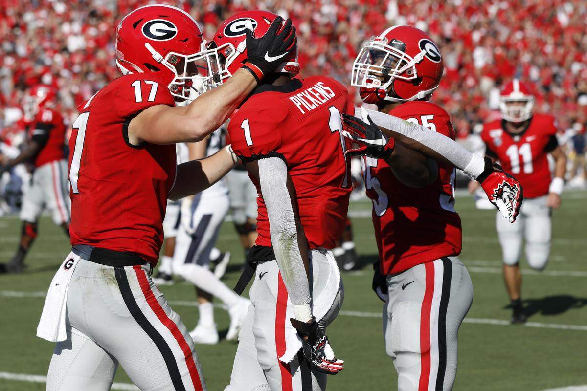 Georgia wide receiver George Pickens (1) celebrates with his teammates after scoring a touchdown against Murray State during the first half of an NCAA college football game Saturday, Sept. 7, 2019, in Athens, Ga.