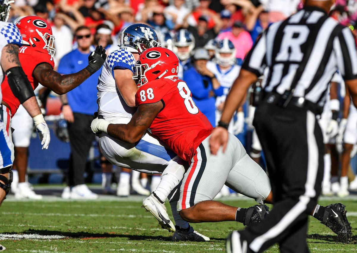 DONN RODENROTH,Athens, Georgia, 10/16/2021: Kentucky quarterback Will Levis gets sacked by Georgia defender Jalen Carter. Georgia beat Kentucky 30-13.